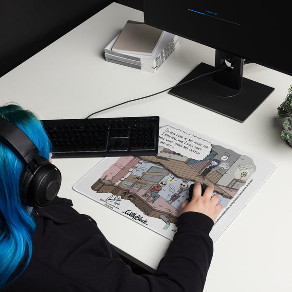 Willy Black comic strip gaming mouse pad on a desk.